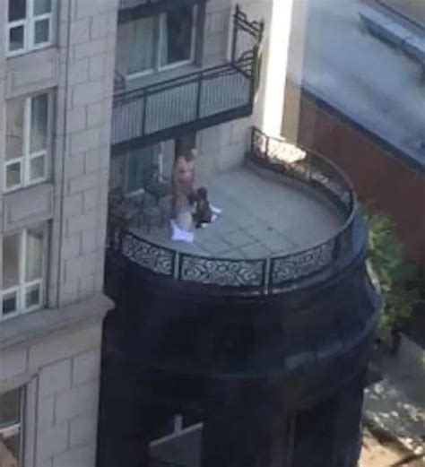 scandalous footage shows two women performing sex act on man on posh hotel balcony mirror online