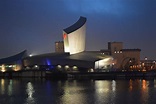 Imperial War Museum North, Manchester at dusk. Architect Daniel ...