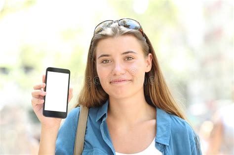 Girl Showing A Blank Phone Screen To A Friend At Home Stock Image