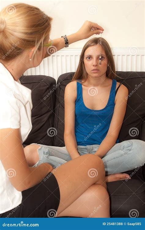 Female Psychotherapist Hypnotizes A Female Patient Stock Photo Image