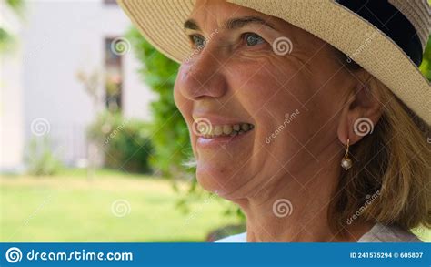 Portrait Of A Mature Woman 55 60 Years Old With A Toothy Smile In A Sun
