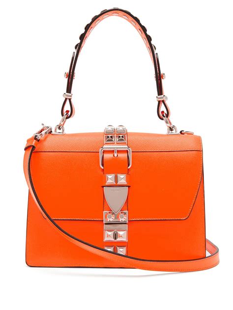 You can get the best discount of up to 85% off. Lyst - Prada Elektra Studded Leather Shoulder Bag in Orange