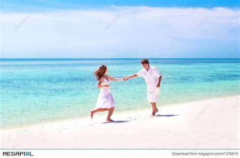 Young Couple Dancing On Beach Of Tropical Island Beach Tropical
