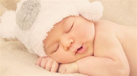 Cute Baby Is Sleeping On Bed Wearing Woolen Knitted Cap Hd Cute