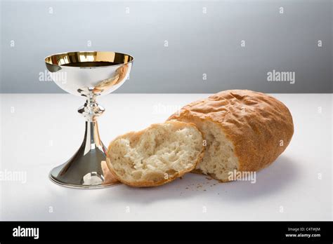 Holy Communion Cup Chalice With Wine And Broken Loaf Of Bread For