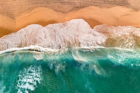 Premium Photo Aerial View Of Sandy Beach With Breaking Waves Top View