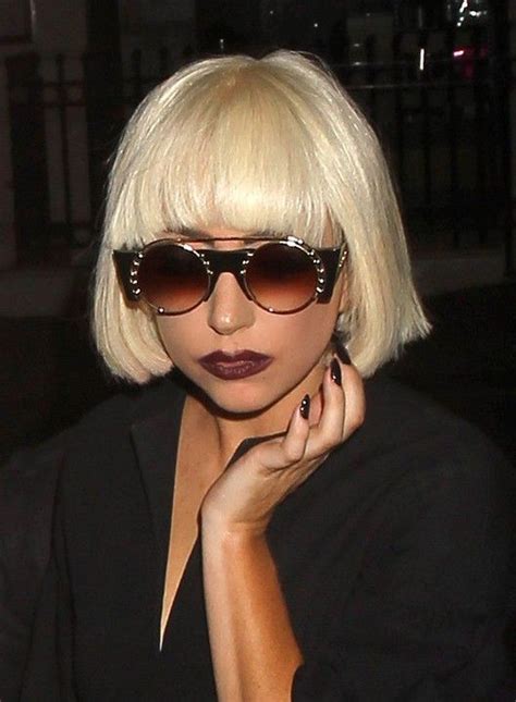 Low angle view of attractive woman with glitter on lips and body looking away isolated on grey. Lady Gaga Short Blunt Bob Haircut with Blunt Bangs | Blunt ...