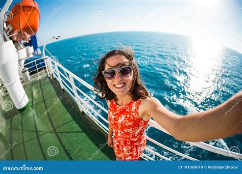 A Woman Is Sailing On A Cruise Ship Stock Photo Image Of Blue