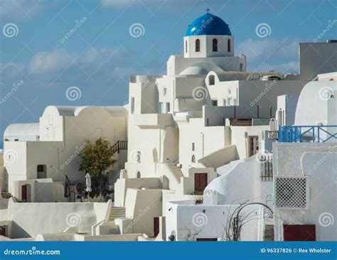 Blue Domed Church And White Washed Buildings Of Santorini Stock Photo