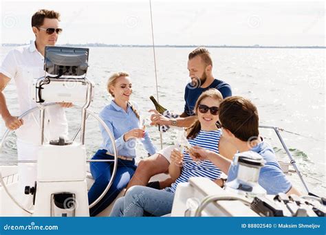 Group Of Happy Friends Traveling On A Yacht Stock Photo Image Of