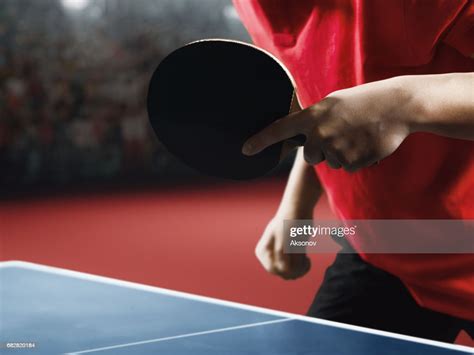 Male Ping Pong Player Holds A Table Tennis Racket And Ball High Res