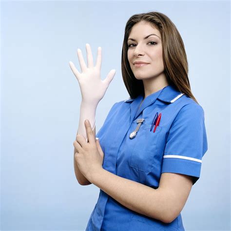 Nurse Pulling On A Glove Photograph By Kevin Curtis