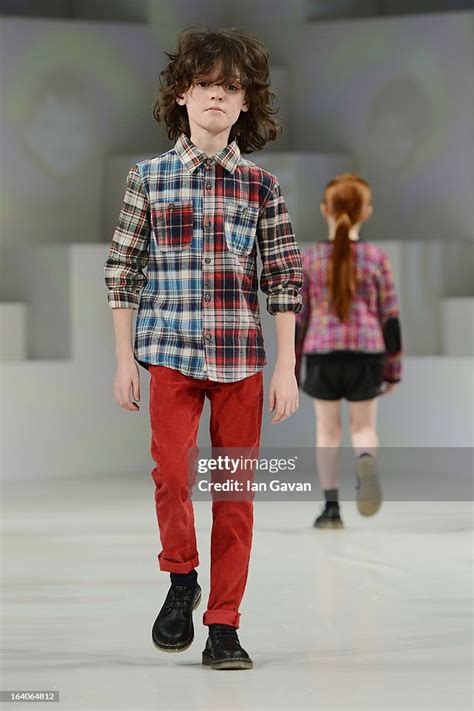 A Model Wearing Tommy Hilfiger Look 32 Autumnwinter Walks The Runway