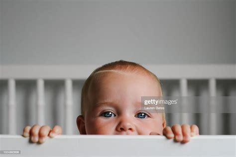 Baby In A Crib High Res Stock Photo Getty Images
