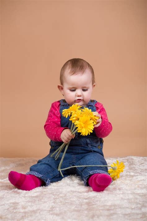 Infant Baby With Yellow Flowers Stock Image Image Of Beige Babies