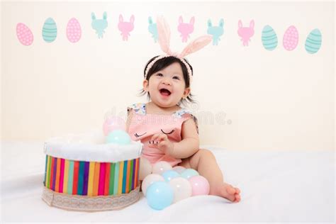 Asian Thai Sweet Baby Girl In Pink Dress Easter Day Stock Photo