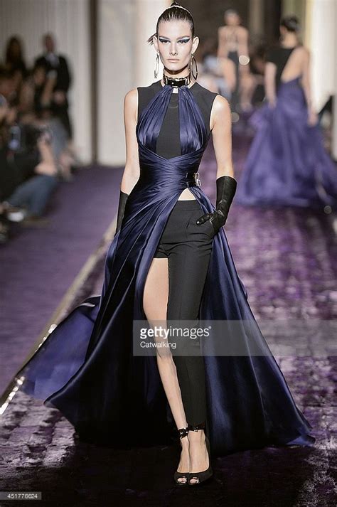 A Model Walks The Runway At The Atelier Versace Autumn Winter 2014