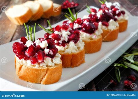 Holiday Crostini Appetizers With Cranberries Pomegranates And Feta