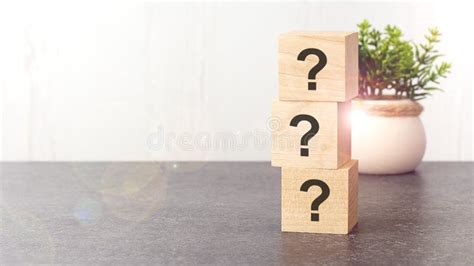 Question Marks On Wooden Dice Standing On Top Of Each Other Stock Image