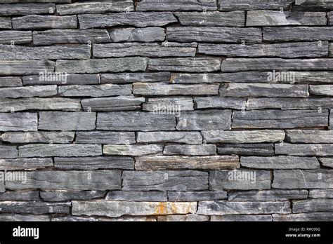 Grey Stone Granite Wall Made Of Stacked Pieces Stones Full Frame Image