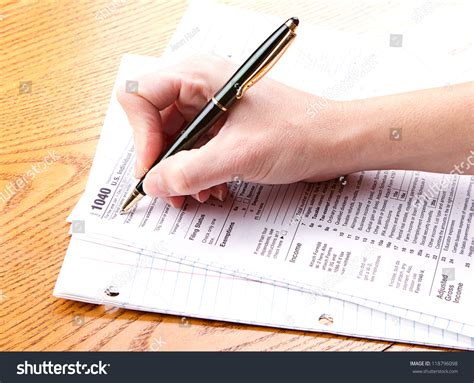 Person Filling Out A 1040 Tax Form Stock Photo 118796098 Shutterstock