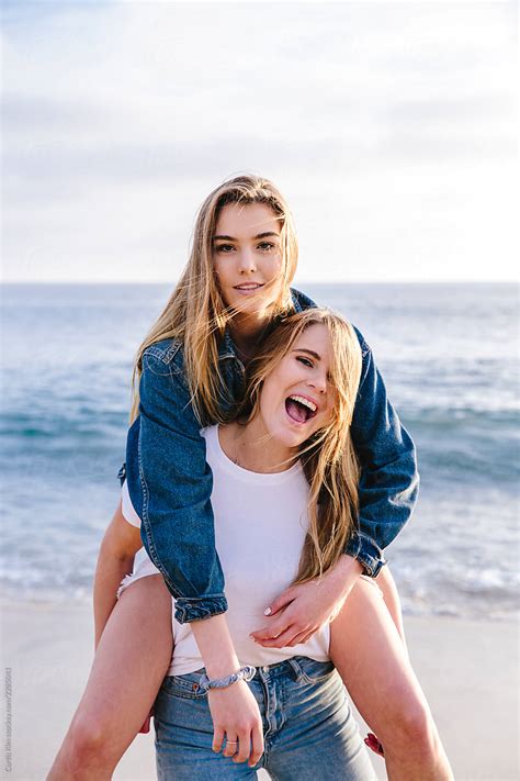 Girl Giving Piggyback Ride To Her Best Friend By Stocksy Contributor
