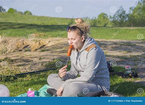 Girl Eating Sausage From The Grill Stock Photo Image Of Beef Girl