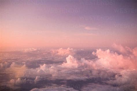 Aerial View Of Clouds In Sky During Sunset Stock Photo