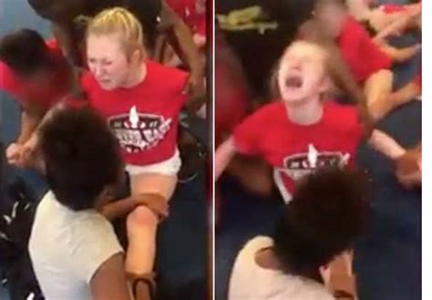 police are investigating this video of a teen cheerleader screaming as she s forced to do splits