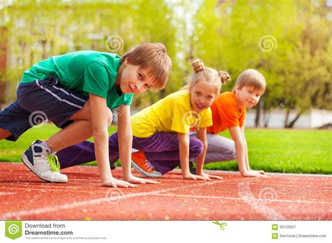 Three Kids Close Up In Uniforms Ready To Run Stock Image Image Of