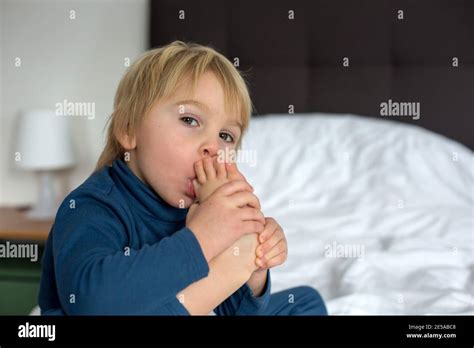 Child Sucking Foot Hi Res Stock Photography And Images Alamy