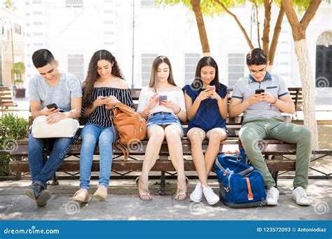 Students Busy Using Their Cell Phones Stock Image Image Of School