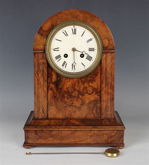 A Victorian Burr Walnut Cased Mantel Clock With French Eight Day