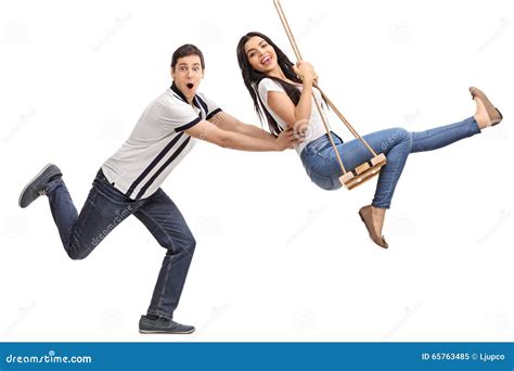 Delighted Man Pushing His Girlfriend On A Swing Stock Image Image Of Joyful Adult 65763485