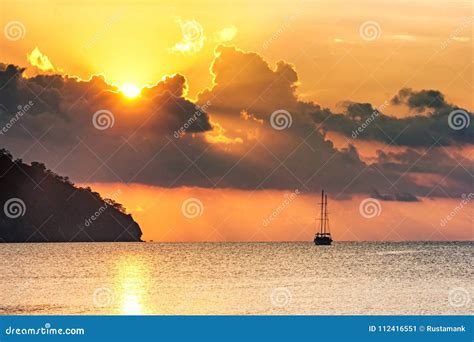 Beautiful Seascape View Of Morning Sea With A Sailboat In The Bay Of