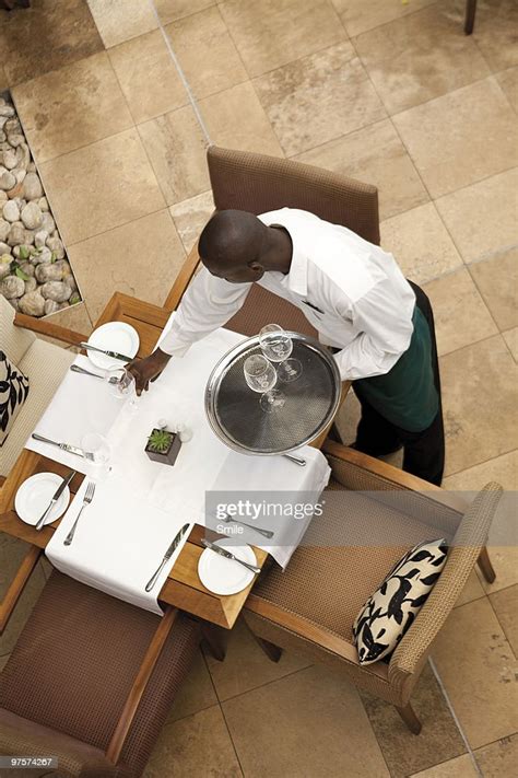Waiter Setting Up Table High Res Stock Photo Getty Images