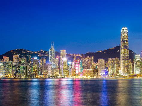 Victoria Harbor In Hong Kong Island Enjoying Light Show And Skyline