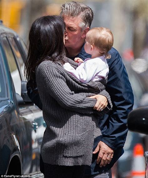 Hilaria Baldwin Kisses Husband Alec While Balancing Daughter Carmen Daily Mail Online