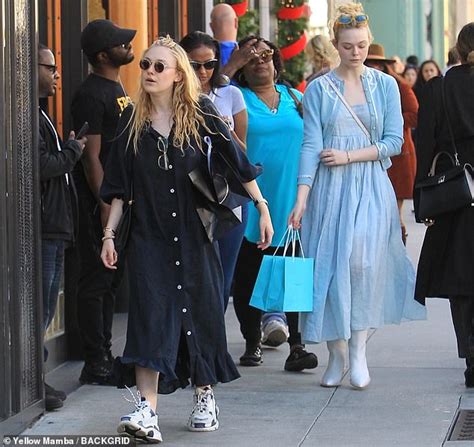 Elle Fanning And Big Sister Dakota Both Wear Long Dresses While