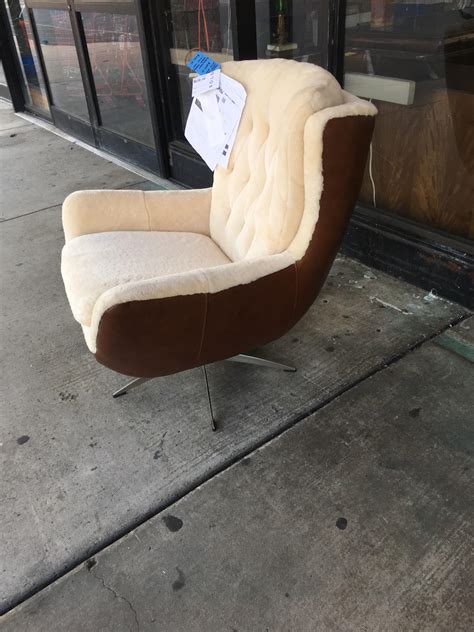 Overstock's office star deluxe wooden banker's chair = $125.99. A pottery barn Wells leather and shearling swivel chair ...
