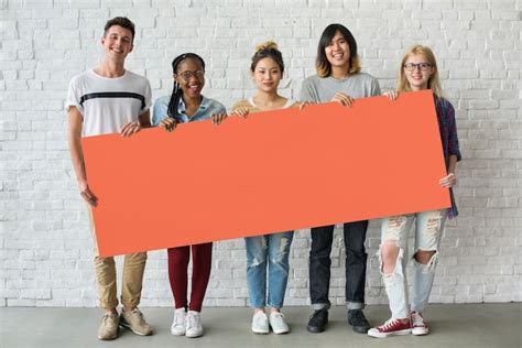 Premium Photo Group Of Friends Holding Blank Banner