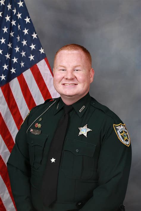 florida sheriff says deputy shot will die manhunt continues miami herald
