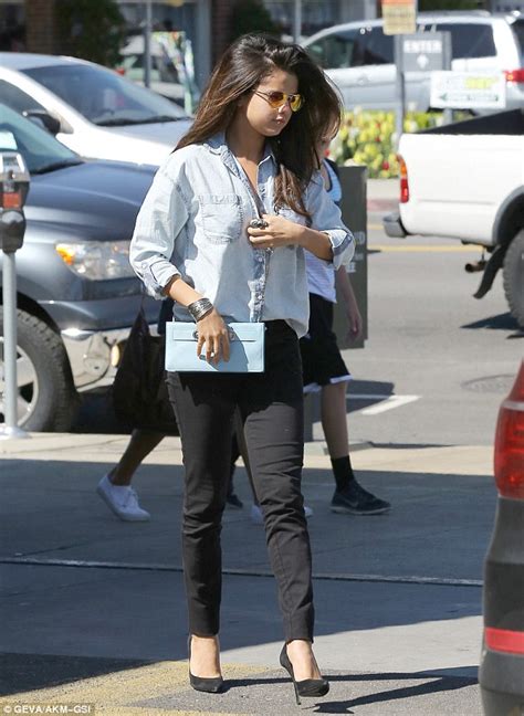 Selena Gomez Is Casually Chic In Pale Blue Shirt And Skinny Black Jeans