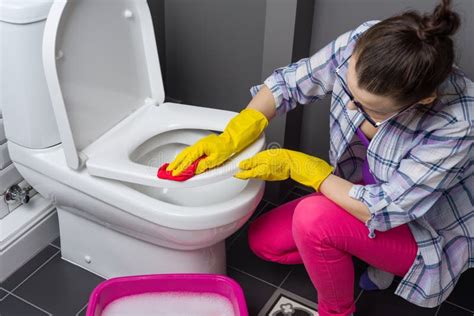 Woman Is Cleaning In The Bathroom Wash The Toilet Stock Photo Image