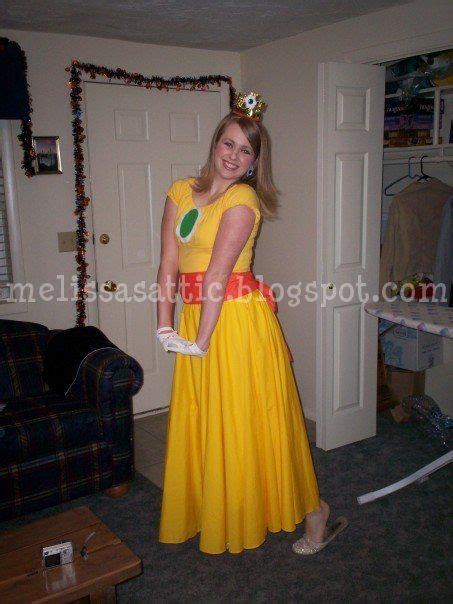 A Woman In A Yellow Dress Posing For The Camera