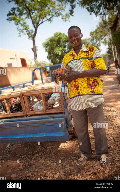 A Vendor Loads Chickens Onto His Trailer At The Poultry Market In
