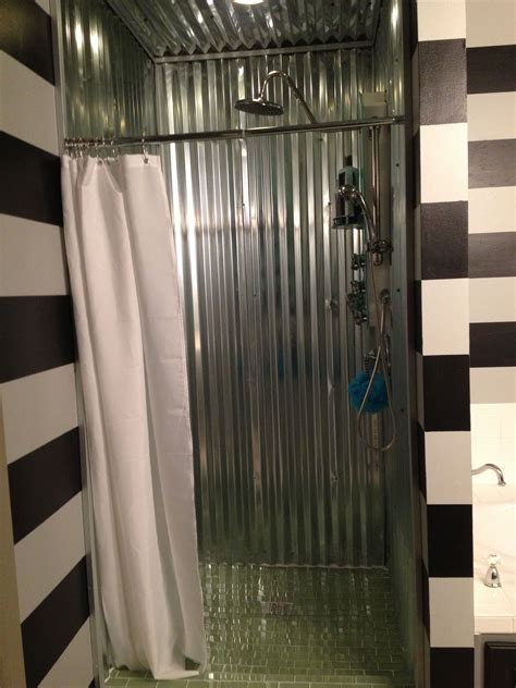 The design by brian morgan architects included exterior metal panels, using inexpensive corrugated. Pin by Misty Welch on DIY | Tin shower walls, Galvanized ...