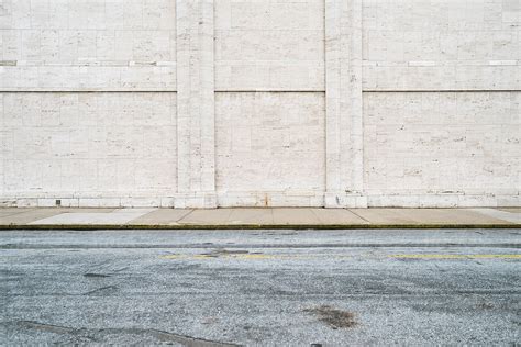 Empty Urban Background With Street And Wall By Stocksy Contributor