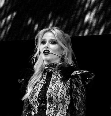 Lady In Black And White Outfit On Stage