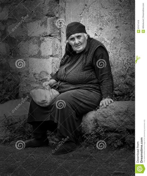 Old Woman Sitting On A Stone In A Caucasian Village Georgia Editorial